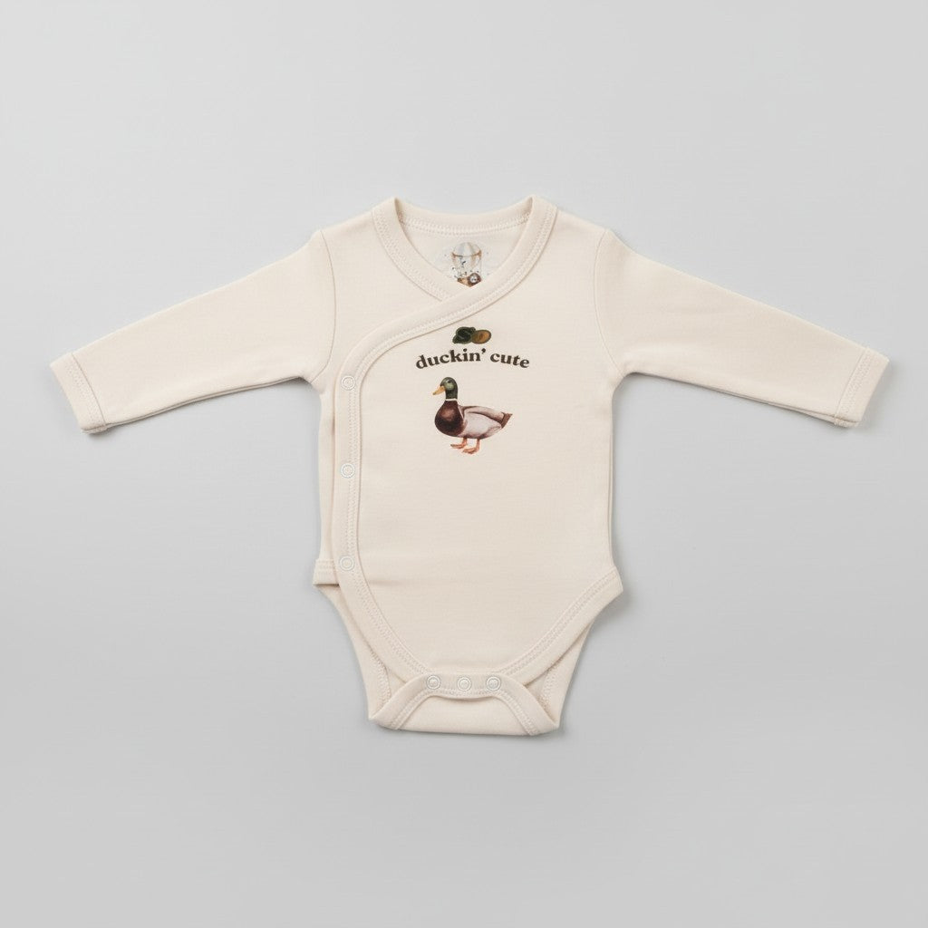 BugAndRoly So Duckin' Cute long sleeve baby bodysuit in birch cotton with a mallard duck graphic on the chest.